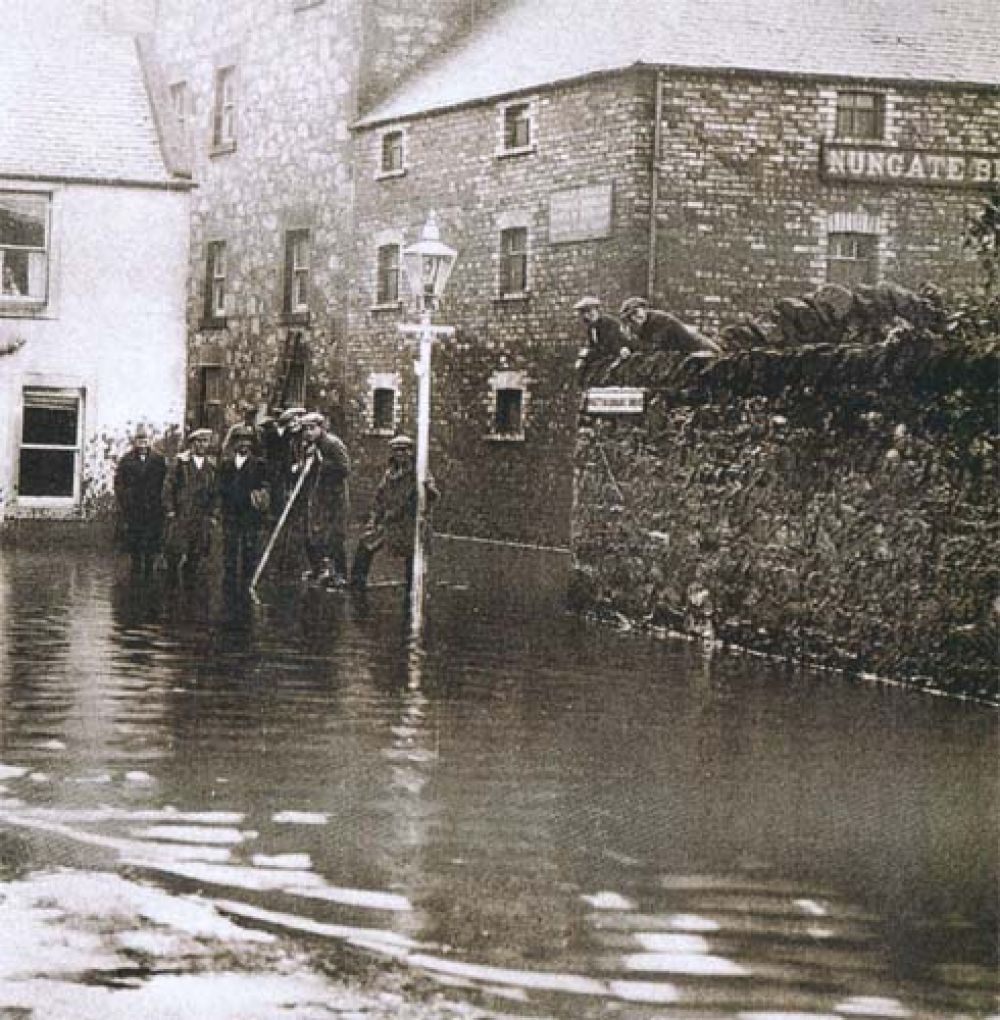 The Nungate Brewery looking down Whittinghame Drive, after the Tyne broke its banks, with the brewery sign clearly visible at the top right.