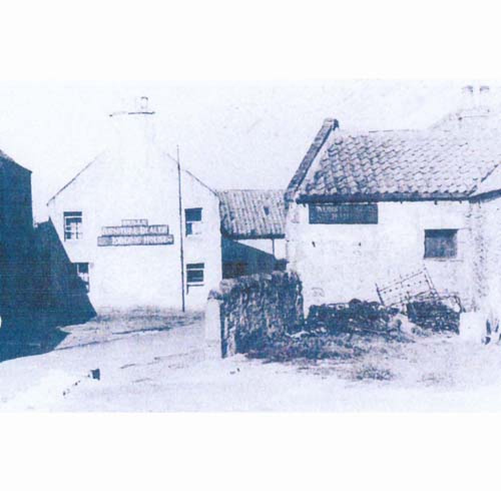 A view of the former Nungate Brewery when it was being used by a furniture dealer, with the maltbarn on the right.