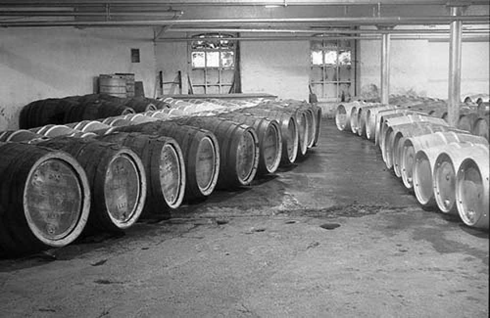 The cask beer cellar in the Thistle Brewery in the 1960s (black-out paint still visible on the windows!). &copy; John Hume, 2015
