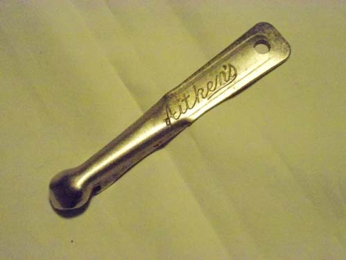 <p>A bottle opener promoting James Aitken & Co (Falkirk) Ltd.</p>